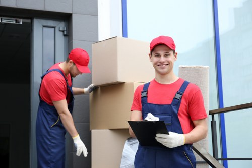Movers planning a piano removal route inside a Westminster property