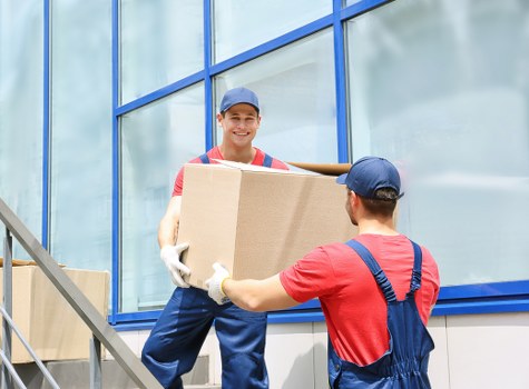 Professional house removals planning in Westminster with moving boxes and a removal van