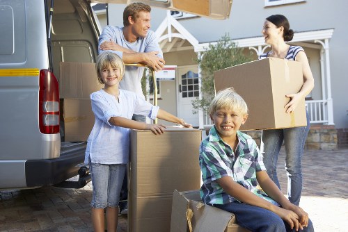 Packers handling fragile household items during a Westminster house move
