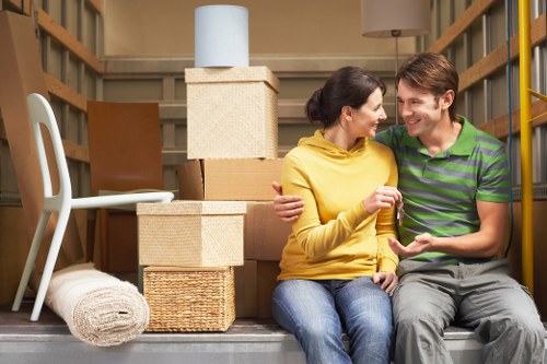 Mover using PPE while handling furniture during a safe relocation