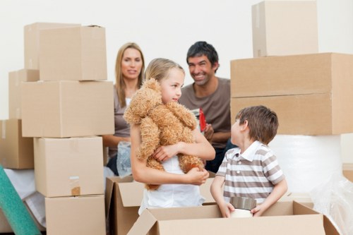 Residential movers handling furniture in a Westminster apartment